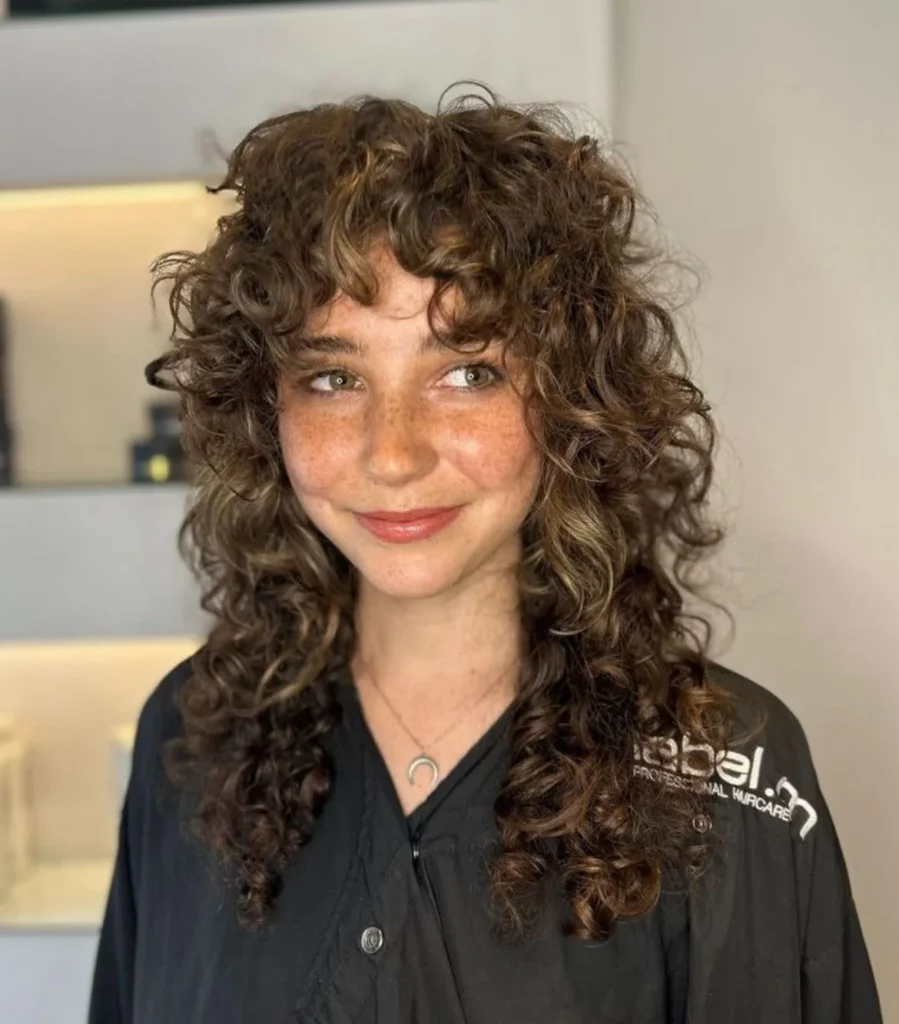 15 Wolf Cut Curly Hair Looks You’ll Love 23 Curly Wolf Cut with Side Part