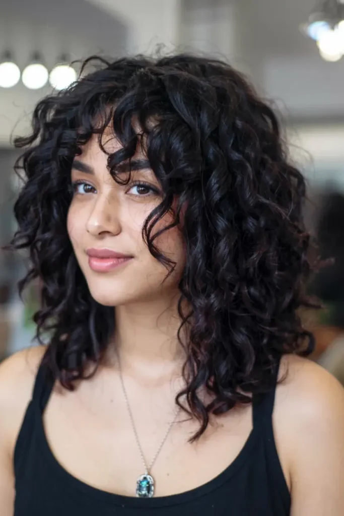 15 Wolf Cut Curly Hair Looks You’ll Love 2 2. Short Curly Wolf Cut