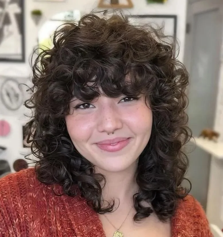 15 Wolf Cut Curly Hair Looks You’ll Love 9 Curly Wolf Cut with Bangs