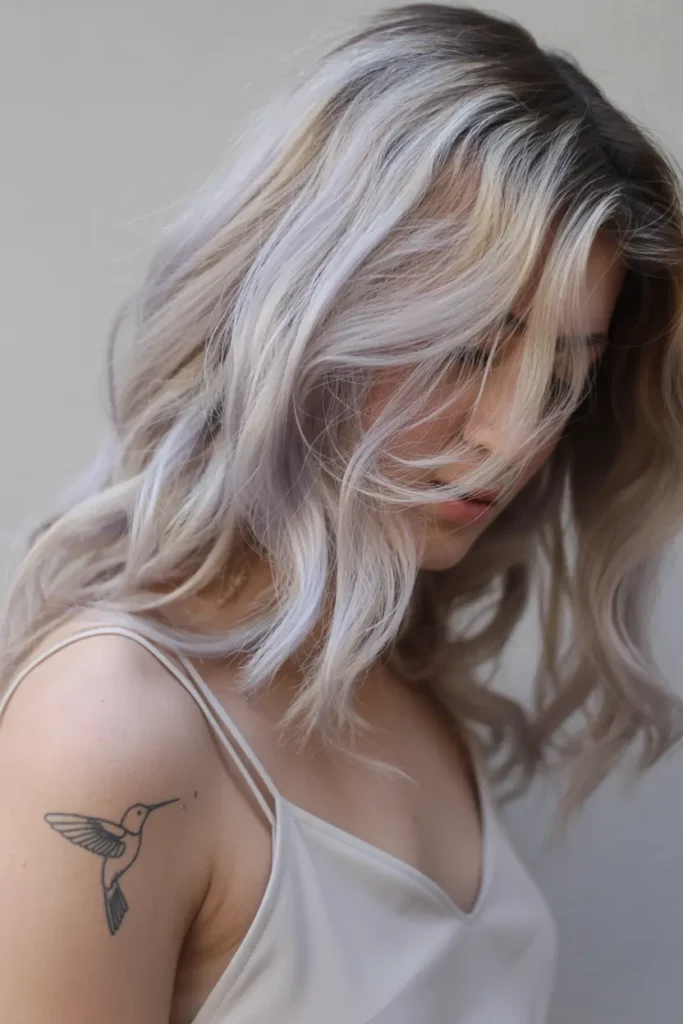 11. Dark Roots Sandy Blonde